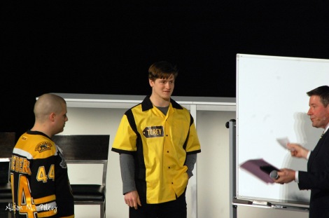 Torey Krug and a fan participate in the Bruins game show event (Photo courtesy of Alison M. Foley)